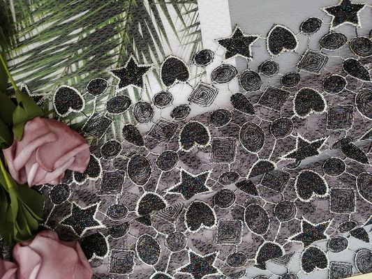 星の形のLurexの女の子の服のための金属着色された刺繍の生地