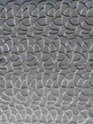 カット・ワークの幾何学的な刺繍されたレースの生地上の灰色すべて
